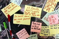 Visitors to the public open house on the draft of the Life Sciences District Master Plan for lands remaining in the former County Ground property leave comments on an aerial photograph of the area.