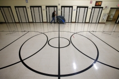 Custodian Kevin Roeve washes the Cedar Hills Elelmentary School gymnasium floor after lunch to prepare the space to resume physical education classes on Oct. 2. An addition to the school with a new gymnasium and main office spaces is part of the Oak Creek-Franklin School District's $60.9 million referendum on the Nov. 6 ballot.