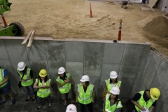 Site Manager Josh Rooker explains progress from the orchestra pit of the  Audtorium addition on the northeast corner of Germantown High School that should be completed in January 2019.