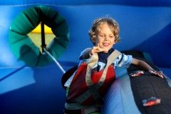 Peter Erickson of Colgate stretches for a target while in the Bungie Run during Germantown Family Fun Carnival Night hosted by the Germantown Recreation Department at Firemen's Park on June 27.