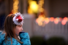 Gabriella Wiebel of Menomonee Falls waits on Main Street with her cousins for the start of the Menomonee Falls Christmas Parade on Nov. 26.