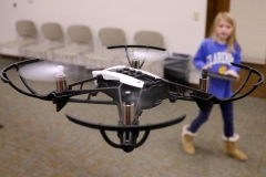 Darby Luebke, 7, controls a Free Flight Parrot drone from a tablet during a Drone Day Fly-In at the Mukwonago Community Library on Feb. 7.