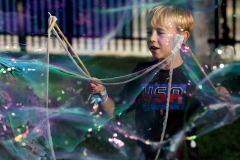 Liam Carlos, 8, of Sussex creates giant soap bubbles during Sussex's National Night Out at the Civic Plaza on Aug. 8.