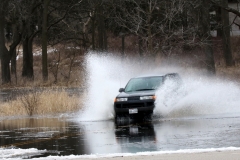 A vehicle charges through standing water on Section Road at the intersection of County Highway EE in Town of Mukwonago on Feb. 21 after two days of rain, warm temeratures and ground frost that stops the ground's absorbtion of water. Town personnel said they have never seen flooding like this in the town. Portions of Behulah Road north and south of the intersection are closed.