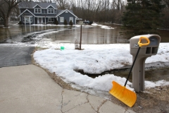 A Century Drive home is surrounded by water in the Town of Mukwonago on Feb. 21 after two days of rain, warm temeratures and ground frost that stops the ground's absorbtion of water. Town personnel said they have never seen flooding like this in the town..