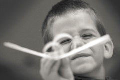 fr 0323 ftf planes ct m6.35 x 4.5Six-year-old Marcus Lee checks the alignment of the wing and tail on one of the paper airplanes he and a dozen other youth made during a March 18 Ultimate Paper Airplane class taught by Karl Debelack offered through the Franklin Recreation Department.