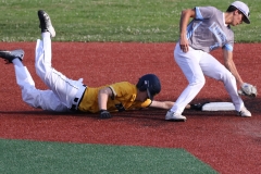 Brookfield Central's Adam Baade brushes back Marquette's Charlie Brockman at second at Hank Aaron Field during WIAA regional final play on July 11.