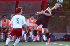 Brown Deer's Kyle Higgins heads the ball away from Shorewood's Liam Quinan at Shoirewood on Sept. 13 that was played to a 0-0 tie.